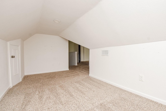 1049 Misty Clf, Dickinson, TX 77539 - bonus room featuring light colored carpet, lofted ceiling, and baseboards