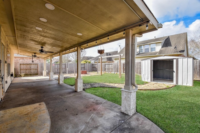 1049 Misty Clf, Dickinson, TX 77539 - view of patio featuring a shed, ceiling fan, and an outbuilding