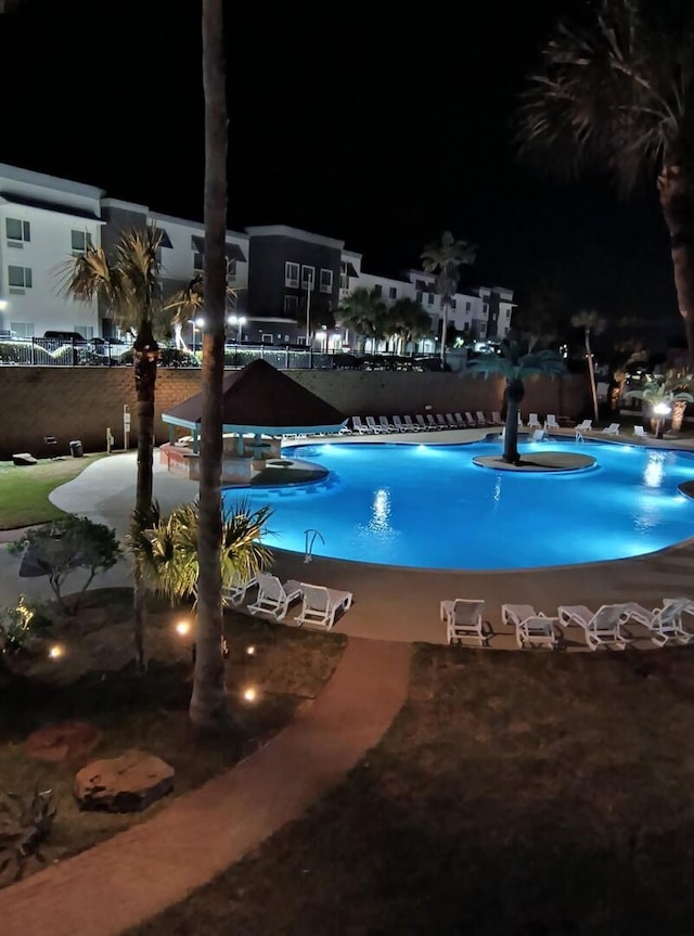 9520 Seawall Blvd Unit 235, Galveston, TX 77554 - pool at twilight featuring a community pool