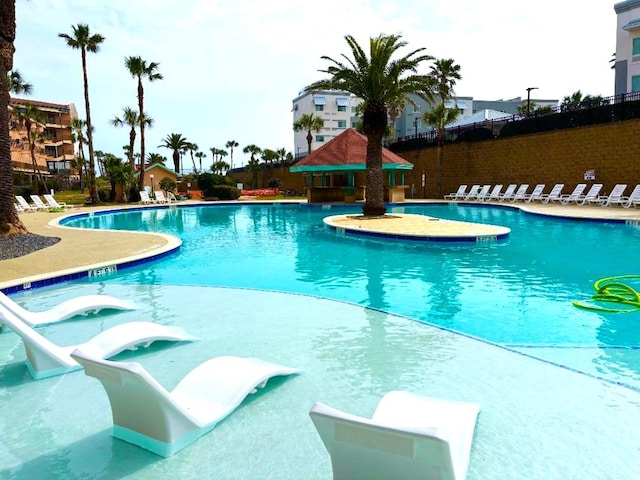 9520 Seawall Blvd Unit 235, Galveston, TX 77554 - community pool featuring fence