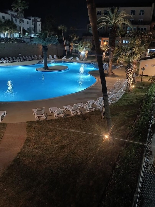 9520 Seawall Blvd Unit 235, Galveston, TX 77554 - pool at night featuring a community pool