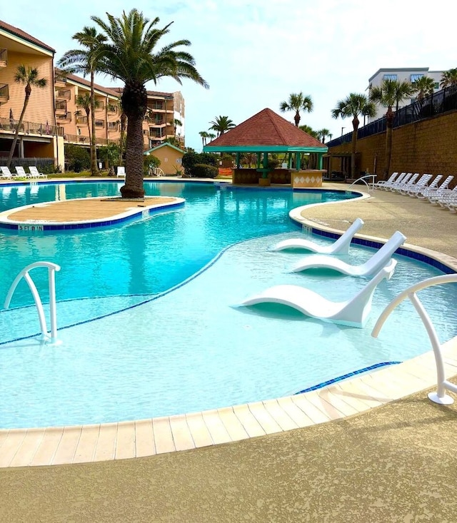 9520 Seawall Blvd Unit 235, Galveston, TX 77554 - community pool with a gazebo and fence