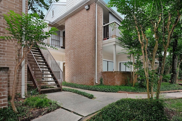 3500 Tangle Brush Dr Unit 217, The Woodlands, TX 77381 - view of building exterior featuring stairway
