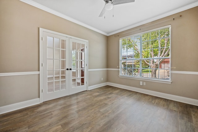 spare room with french doors, wood finished floors, crown molding, baseboards, and ceiling fan