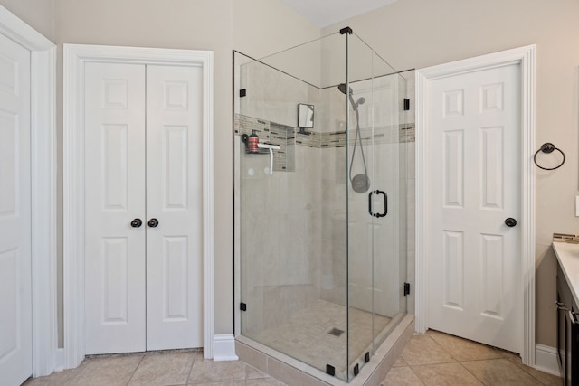 bathroom featuring a stall shower and tile patterned floors