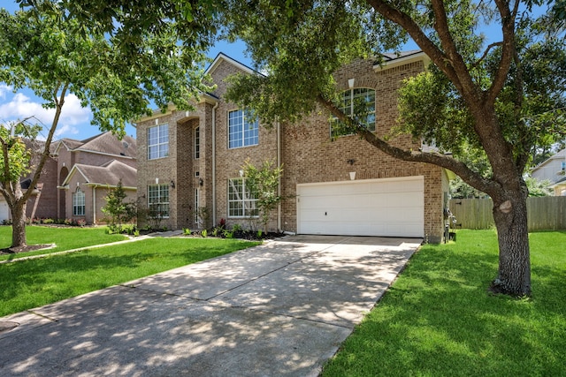 traditional-style home with concrete driveway, brick siding, and an attached garage
