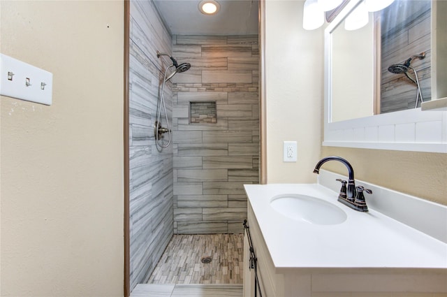 3711 Clover Meadows St, Pasadena, TX 77505 - bathroom with a tile shower, vanity, and recessed lighting