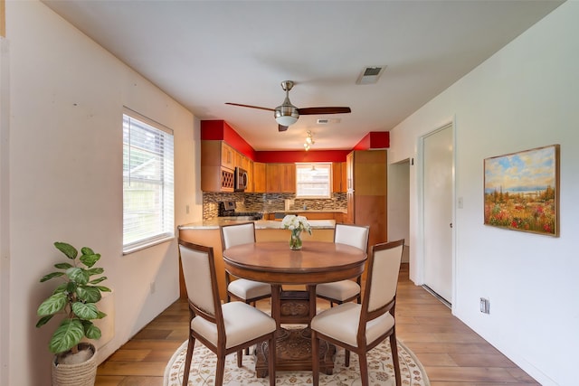 3711 Clover Meadows St, Pasadena, TX 77505 - dining space featuring light wood-type flooring and a ceiling fan