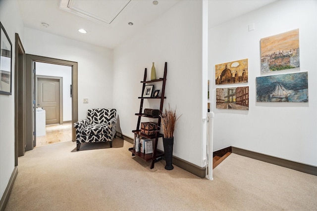 sitting room featuring light carpet, recessed lighting, attic access, and baseboards