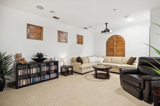 carpeted living area featuring recessed lighting