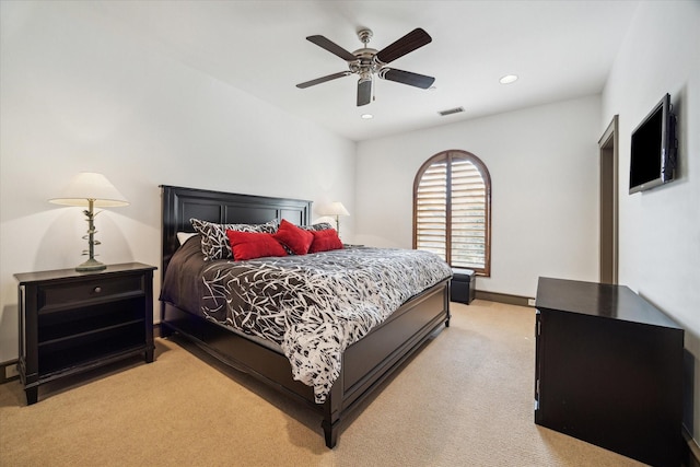 bedroom with light carpet, recessed lighting, baseboards, and ceiling fan