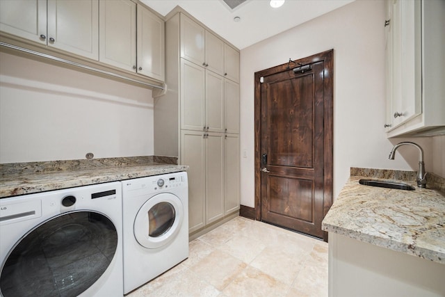 washroom featuring separate washer and dryer, cabinet space, light tile patterned flooring, and recessed lighting