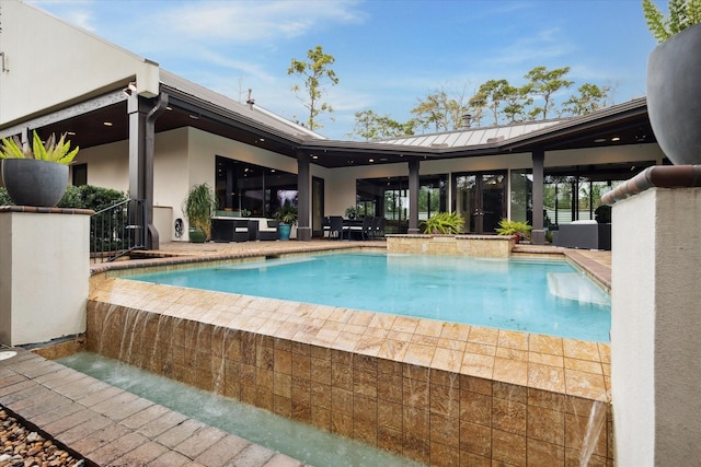 view of pool featuring a patio, french doors, and a pool with connected hot tub