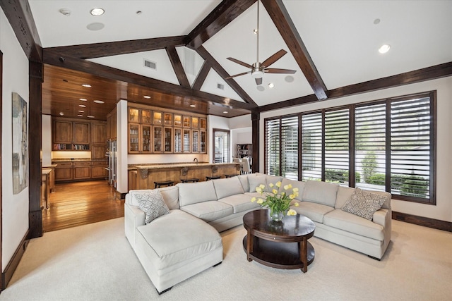 living area with beamed ceiling, light colored carpet, ceiling fan, recessed lighting, and baseboards