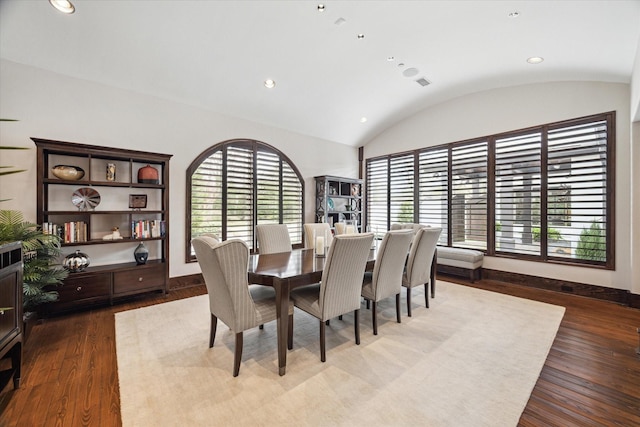 dining area with healthy amount of natural light, wood finished floors, lofted ceiling, baseboards, and recessed lighting