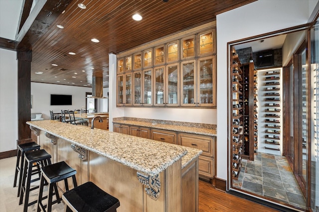 wine room featuring wooden ceiling, recessed lighting, dark wood-type flooring, and baseboards