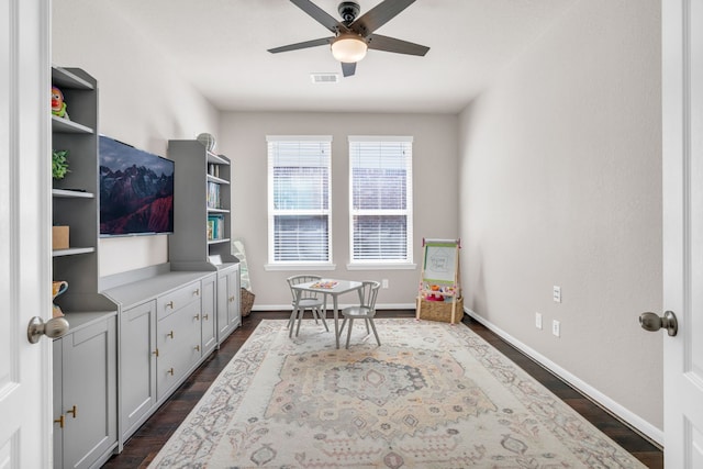 9962 Ash Creek Ct, Brookshire, TX 77423 - living area featuring a ceiling fan, dark wood-style floors, and baseboards