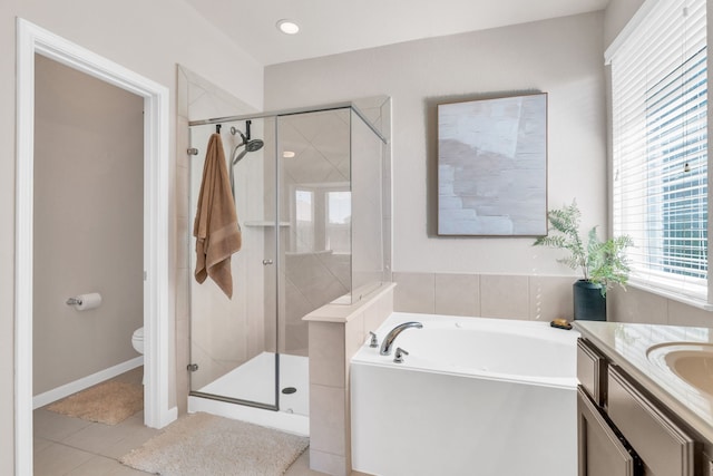9962 Ash Creek Ct, Brookshire, TX 77423 - bathroom with a stall shower, a bath, toilet, and tile patterned floors