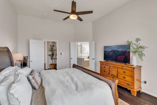 9962 Ash Creek Ct, Brookshire, TX 77423 - bedroom with dark wood-type flooring, lofted ceiling, ensuite bathroom, baseboards, and ceiling fan