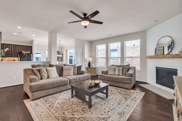 9962 Ash Creek Ct, Brookshire, TX 77423 - living area featuring a ceiling fan, dark wood-style floors, a fireplace, baseboards, and recessed lighting