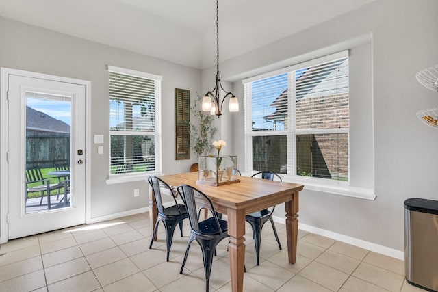 9962 Ash Creek Ct, Brookshire, TX 77423 - dining space with a chandelier, baseboards, and light tile patterned floors