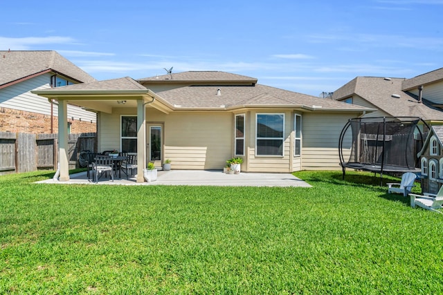 9962 Ash Creek Ct, Brookshire, TX 77423 - back of house featuring a trampoline, a patio, and roof with shingles