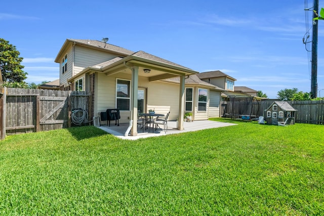 9962 Ash Creek Ct, Brookshire, TX 77423 - rear view of property with a patio, a shed, and an outbuilding