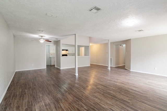 5935 Caruso Forest Dr, Houston, TX 77088 - unfurnished living room with dark wood finished floors, a textured ceiling, baseboards, and a ceiling fan