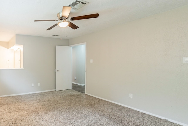 5935 Caruso Forest Dr, Houston, TX 77088 - empty room with carpet floors, a ceiling fan, and baseboards