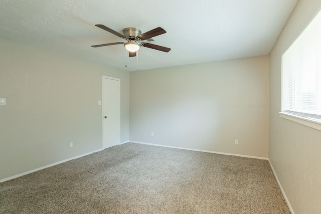 5935 Caruso Forest Dr, Houston, TX 77088 - carpeted spare room featuring a ceiling fan and baseboards