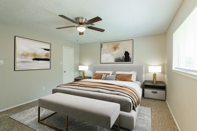 5935 Caruso Forest Dr, Houston, TX 77088 - carpeted bedroom with baseboards and a ceiling fan