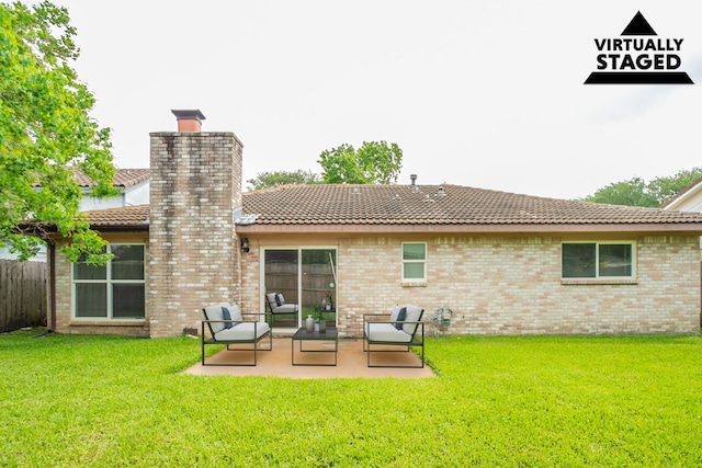 5935 Caruso Forest Dr, Houston, TX 77088 - back of house featuring a patio area, a chimney, and a tiled roof