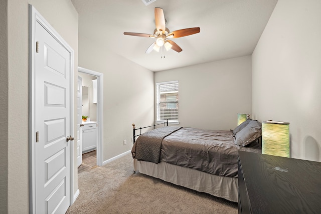 27916 Seger Bend Trl, Spring, TX 77386 - bedroom with light colored carpet, baseboards, ensuite bath, and ceiling fan