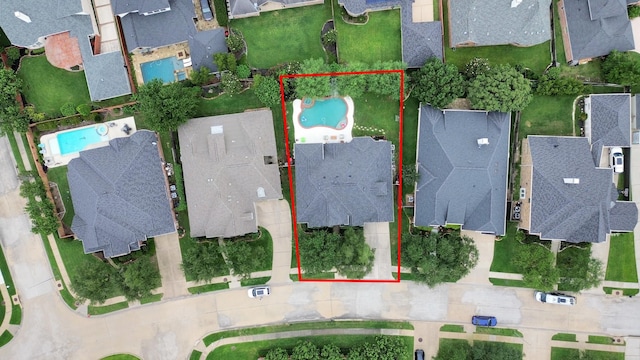 aerial perspective of suburban area with a pool and property boundaries highlighted