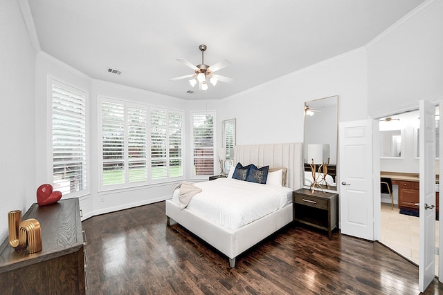 bedroom with dark wood-style floors, ornamental molding, and a ceiling fan