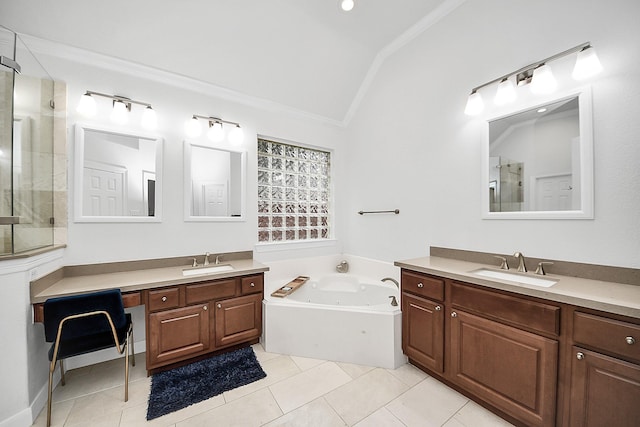 full bath with lofted ceiling, ornamental molding, a shower stall, two vanities, and a whirlpool tub