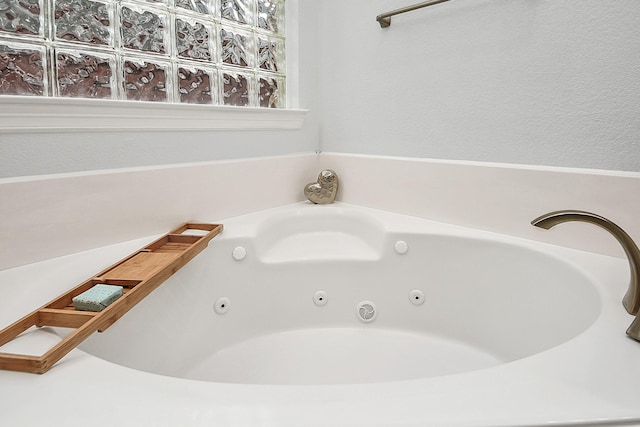 bathroom with a whirlpool tub