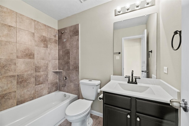 full bath with toilet, vanity,  shower combination, and baseboards