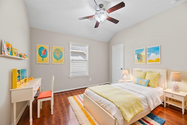 bedroom featuring vaulted ceiling, wood finished floors, baseboards, and a ceiling fan