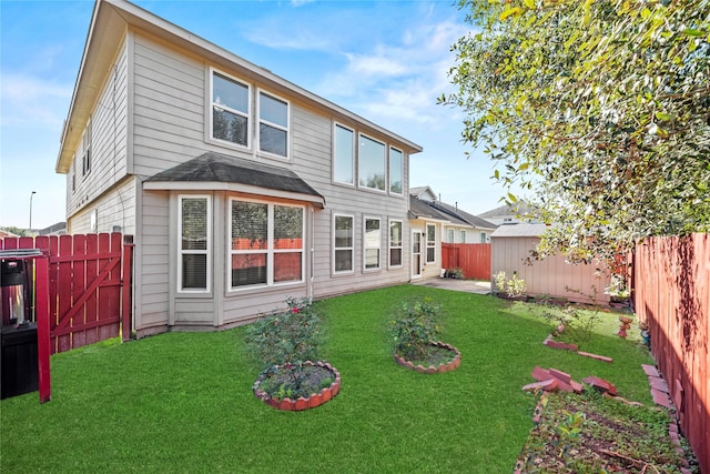back of house featuring an outbuilding, a storage shed, a gate, and a patio