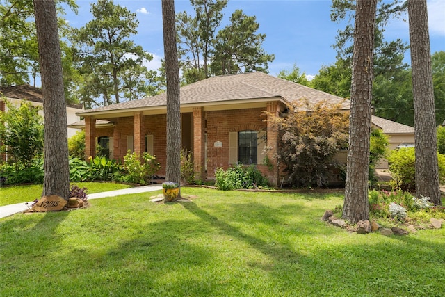 12915 Lake Mist Dr, Cypress, TX 77429 - ranch-style house featuring a front lawn, brick siding, and a shingled roof