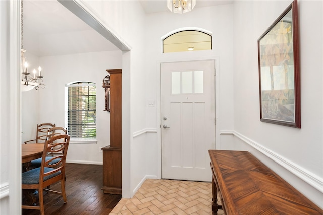 12915 Lake Mist Dr, Cypress, TX 77429 - foyer with a chandelier, baseboards, and wood finished floors
