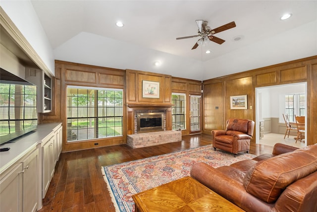 12915 Lake Mist Dr, Cypress, TX 77429 - living area with vaulted ceiling, dark wood-style flooring, a ceiling fan, a brick fireplace, and recessed lighting