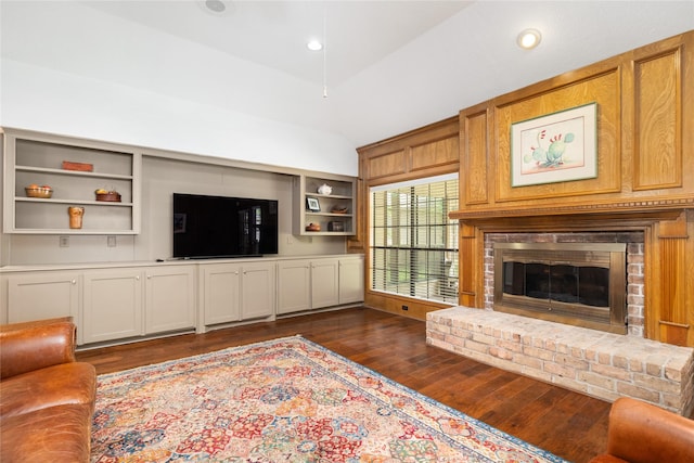 12915 Lake Mist Dr, Cypress, TX 77429 - living room featuring dark wood finished floors, lofted ceiling, a fireplace, and recessed lighting