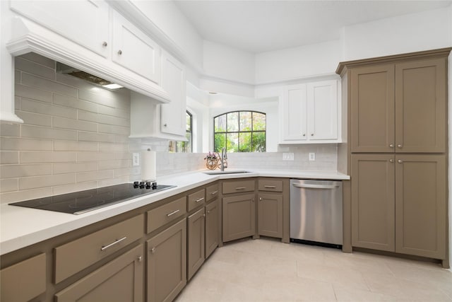 12915 Lake Mist Dr, Cypress, TX 77429 - kitchen featuring dishwasher, a sink, black electric stovetop, decorative backsplash, and light countertops
