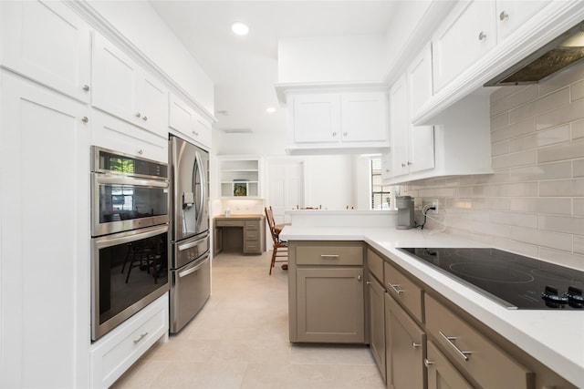 12915 Lake Mist Dr, Cypress, TX 77429 - kitchen featuring appliances with stainless steel finishes, decorative backsplash, light countertops, white cabinetry, and recessed lighting