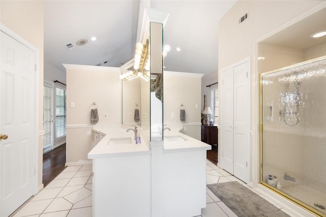 12915 Lake Mist Dr, Cypress, TX 77429 - bathroom with tile patterned floors, a stall shower, double vanity, crown molding, and recessed lighting