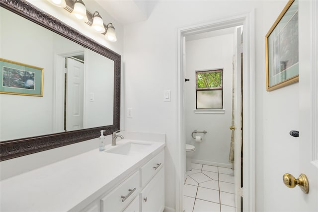12915 Lake Mist Dr, Cypress, TX 77429 - bathroom featuring tile patterned floors, toilet, vanity, and baseboards