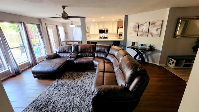 18534 Wolf Creek Trl, Humble, TX 77346 - living room featuring ceiling fan, baseboards, recessed lighting, and wood finished floors