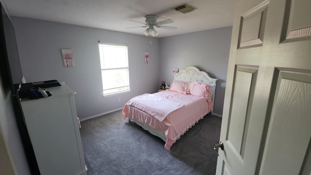 18534 Wolf Creek Trl, Humble, TX 77346 - bedroom featuring baseboards, dark colored carpet, and ceiling fan
